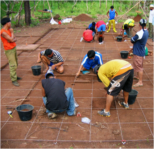Kuikuro Indigenous people excavate a house at the ancient ancestral site of Ngokugu. 
