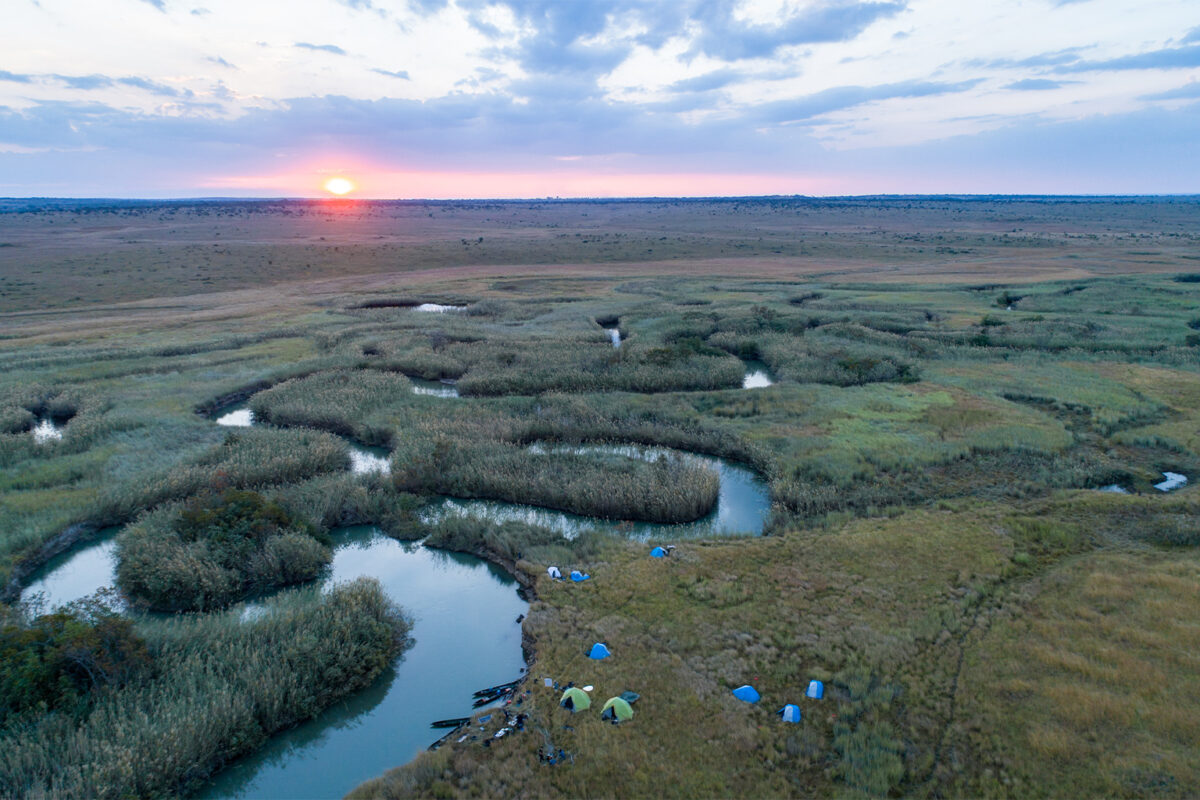 Aerial view of the Cuando River at sunset.
