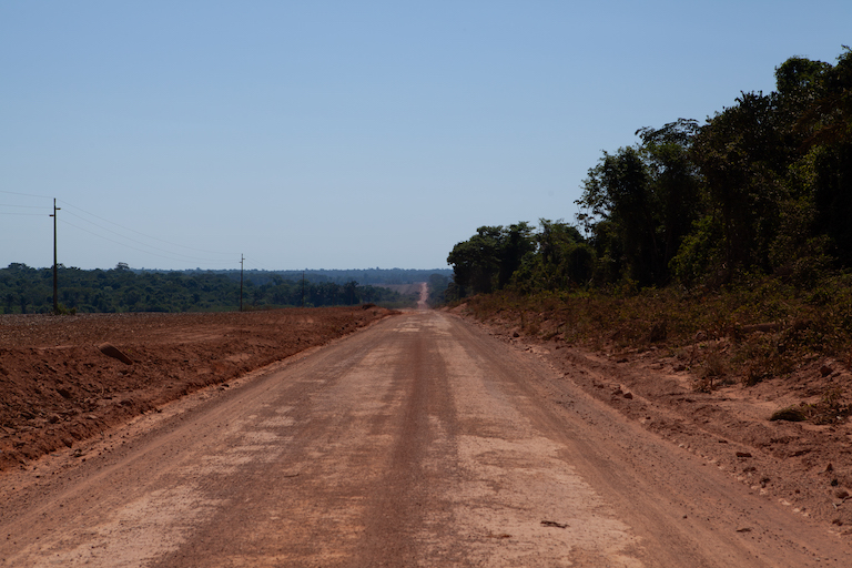 The MT-322 highway slices through a vast oasis of rainforest in Mato Grosso state, which is home to 18 different Indigenous groups. Efforts to pave a stretch of the road and build a bridge extending it over Xingu River have set off deforestation and land speculation in the region, even though the project has yet to receive environmental licensing. Ana Ionova for Mongabay.